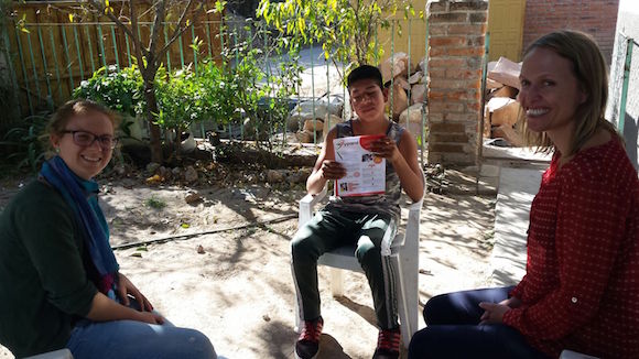 young Mexican farmer holding the YPARD brochure